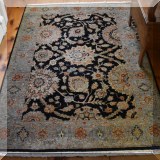 D07. Dark ground Indian hand knotted rug. Measures approx. 4' x 6' 